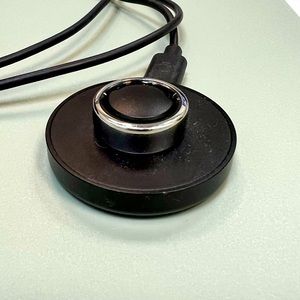 Oura fitness ring , size 7 , comes with charger no box . Like new